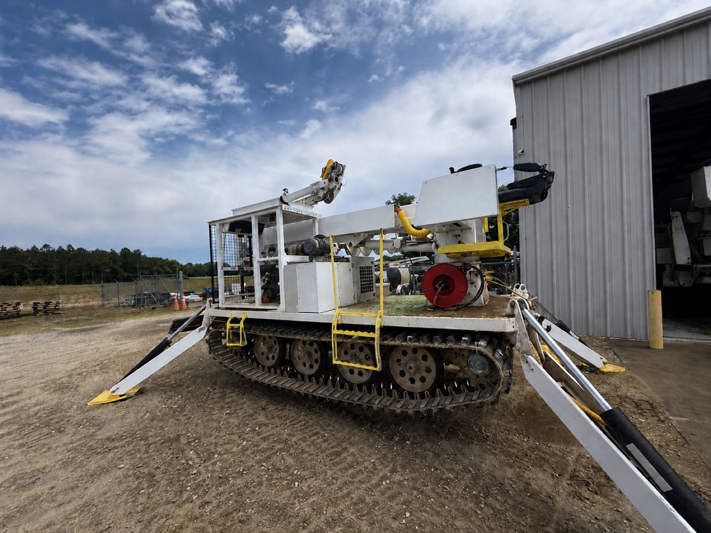UTV tracked drill rig before wash